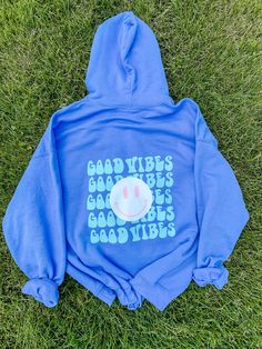 Adorable lavender hoodie featuring good vibes in a seafoam color and a pink and white smiley face. Perfect spring and summer hoodie to throw on for cooler nights. Unisex/men's sizing; runs oversized and comfy. Message for additional color requests or a graphic on the front! Aesthetic Sweatshirts & Hoodies, Trendy Purple Hoodie With Drawstring, Trendy Purple Hoodie With Graphic Print, Oversized Light Blue Hoodie For Loungewear, Purple Letter Print Hoodie For Spring, Spring Purple Hoodie With Letter Print, Spring Purple Letter Print Hoodie, Trendy Purple Hoodie With Letter Print, Trendy Purple Hoodie For Spring