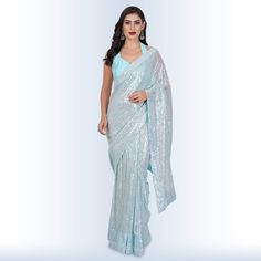 Introducing our stunning "1 Minute Sequin Saree - Baby Blue"! ✨ Elevate your elegance with this georgette masterpiece that effortlessly combines tradition with modern style. 🌟Designed for the busy, modern woman, this saree comes pre-stitched, saving you precious time on draping. Its mesmerizing baby blue hue is complemented by intricate sequin detailing that sparkles with every move you make. 💃The included backless blouse adds a touch of allure, making you the center of attention at any event. Blue Sequin Saree, Reception Outfits, Sequin Saree, Backless Blouse, Baby Blue Colour, Blue Saree, Sari Blouse, Pastel Blue, Blue Hues