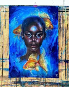 a painting of a woman with two gold fish in her hair and one blue background