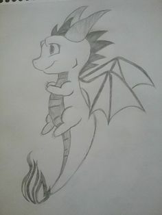 a drawing of a dragon sitting on top of a piece of paper