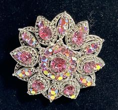 Gorgeous Bright and light pink AB stones against a silver tone floral setting.  .  the brooch measures 2" round, it is a real statement piece.  there are no missing stones and the pin works great.  This pin has been used very little. Pink Rhinestone Brooches For Formal Occasions, Pink Aurora Borealis, Pink Aurora, Floral Brooch, Aurora Borealis, Statement Pieces, Brooch Pin, Brooches, Aurora