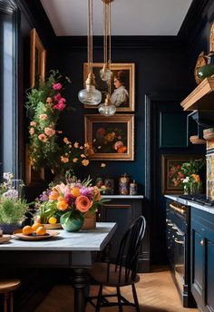 a dining room table with flowers and fruit on it