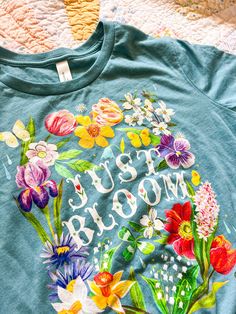 a t - shirt with flowers painted on it