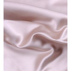 a close up view of a pink satin fabric