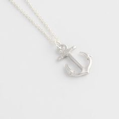 Anchor Necklace for women This anchor necklace is a symbol of hope and safety, making it a great gift for those who go out to sea. The stainless steel chain is sturdy, and Cover yourself in the light of the moon with the Anchor Necklace. Reminiscent of a starry night at sea, the Anchor Necklace for women features a large, authentic anchor pendant, crafted from silver and accented with white crystals. Pair this piece with your favorite dress and some silver flats for a classic look that is perfec Anchor Shaped Jewelry With Adjustable Chain For Gift, Silver Anchor Necklace Nautical Style, Everyday Silver Jewelry With Anchor Shape, Everyday Silver Anchor Jewelry, Nautical Sterling Silver Anchor Necklace, Silver Anchor Jewelry With Lobster Clasp, Adjustable Anchor-shaped Necklace For Gifts, Silver Nautical Anchor Jewelry, Silver Anchor-shaped Nautical Jewelry