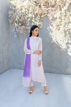 SKU: 2201 Price for Shirt, lining & Pants This immaculately crafted lilac pleated ensemble is all set to make its way to our festive wardrobe. Adorned with glistening pearls, thread, and hand embellished with crystals. This ensemble comes up with a gorgeous double shaded duppatta to complete the look. Dupatta as is can be added to complete this serene outfit. Purple Silk Sets For Formal Occasions, Elegant Lavender Party Sets, Elegant Lavender Festive Sets, Elegant Lavender Sets For Festive Occasions, Elegant Festive Lavender Sets, Festive Lavender Long Sleeve Set, Spring Wedding Purple Sets, Purple Wedding Sets For Spring, Serene Outfit