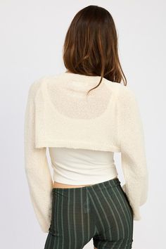 This imported Blouson Sleeve Bolero is made from 40% acrylic, 40% polyester, and 20% artificial hemp. The model wears a size small with a height of 5'9. Comfortable and stylish, it adds a touch of elegance to any outfit. Trendy Acrylic Tops For Layering, Chic Fitted Acrylic Sweater, Soft Knit Acrylic Tops For Spring, Chic Acrylic Winter Outerwear, Spring Beige Acrylic Tops, Fitted Acrylic Winter Outerwear, Cozy Fitted Acrylic Cardigan, Versatile Stretch Winter Shrug, Versatile Stretch Shrug For Winter