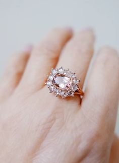 She is a showstopper, a statement piece and not for the faint of heart. You will find her making her presence known. I set this Peachy Pink cushion cut tourmaline in rose gold to compliment the pink tones of the stone and the rosecut diamonds add to the softness of this bold ring. Pink Morganite Halo Jewelry, Delicate Pink Rings With Rose Cut Diamonds, Rose Cut Diamond Jewelry With Pink Sapphire For Weddings, Wedding Jewelry With Rose Cut Diamonds And Pink Sapphire, Pink Tourmaline Wedding Jewelry, Rose Gold Tourmaline Wedding Ring, Luxury Pink Rose Cut Diamond Wedding Jewelry, Wedding Jewelry With Rose Cut Diamonds And Tourmaline, Delicate Pink Jewelry With Rose Cut Diamonds