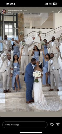 a bride and groom posing for a photo in front of their wedding party