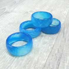 Blue agate faceted band rings. Unique carved gemstone statement ring. Stone - colorful blue agate. Size: 7, 7.5, 7 3/4, 8, 8 1/4, 8.5, 11, 11.5, 12, 12.5 ( US and Canada ), O, P, P 1/2, Q, Q 1/2, Q 3/4, V 1/2, W 3/4, Y, Z ( UK and Australia ), 17 1/4, 17.5, 17 3/4, 18, 18 1/4, 18.5, 21, 21.5, 22, 22.5 ( European size ). Width: 8 - 9 mm, thickness 2-3 mm. WARNING: solid stone rings are fragile. Please treat them carefully and avoid dropping your ring on the floor or hitting it against hard surfac Handmade Blue Agate Rings, Agate Stone Meaning, Ace Ring, Resort Jewelry, Stacked Rings Boho, Rings Unique, Jewelry Beach, Unisex Gift, Agate Jewelry