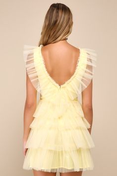 Everyone will be asking where you shop when you stroll into the party wearing the Lulus Striking Sensation Yellow Tulle Tiered Ruffled Mini Dress! Airy tulle overlays this iconic dress that has a sleeveless bodice with princess seams and a deep V-neckline (with a matching V-back). Skirt has a flirty tiered design with double layers of tulle, finishing at a mini hem. Hidden zipper/clasp at back. Fit: This garment fits true to size. Length: Mid-thigh. Size medium Bust: Great for any cup size. Wais Baby Blue Mini Dress Formal, Hoco Dress Ruffles, Mini Poofy Dress, Short Yellow Dress Formal, Yellow Formal Dress Short, Over The Top Dresses, Fun Hoco Dresses, Modest Hoco Dresses, Homecoming Dresses Flowy