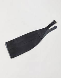 Cotton and silk satin cummerbund This cotton and silk satin cummerbund is an essential accessory for completing iconic and elegant tuxedos. Following tradition, its smooth and semi-glossy fabric is crafted with a three-layer pleated technique. An adjustable closure completes the accessory. Black Silk Tuxedo For Evening, Black Silk Tuxedo For Evening Events, Black Silk Tuxedo For Party, Elegant Black Satin Tuxedo, Silk Fitted Suit And Tie Accessories For Black Tie, Elegant Fitted Satin Sashes, Elegant Formal Sash With Satin Finish, Elegant Fitted Black Sashes, Fitted Satin Sash For Evening