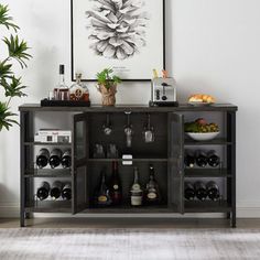 a wine cabinet with bottles and glasses on it