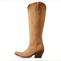 Endlessly wearable and effortlessly stylish, this tall boot looks just as good with jeans and a sweater as it does with dresses and skirts. Bonus: StretchFit allows it to fit a wide range of calves. Laramie StretchFit Western Boot | Product Features : 0 : ATS® technology provides ergonomic support on uneven terrain, 1 : StretchFit panels under the pull tabs give an additional inch to fit a wide range of calves, 2 : Hand-nailed Veg Tan leather sole, 3 : Resoleable Goodyear leather welt constructi New West, Tall Boot, Veg Tan Leather, Western Boot, Dijon, Tall Boots, All Colors, Western Boots, Tan Leather