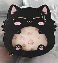 "PREORDERS FOR BLACK GETOCAT BAG ARE OPEN ON MY STORE yulicechan.com An itabag featuring everyone's favorite cat with bangs! This ita bag is made with pu leather as well as cotton insides for a sturdy exterior and a soft interior. It comes with one main storage compartment as well as 4 internal pockets: one large padded pocket, two smaller open pockets, and one zipper pocket. Itabag Size: 9\" x 9\" x 3\" (14\" total with tail and ears) The ita bag includes: - 1 Removable tail - 1 Crossbody strap Cute Large Capacity Storage Bags, Cute Black Large Capacity Satchel, Kawaii Large Capacity Crossbody Bag, Cute Black Satchel With Large Capacity, Cute Large Capacity Black Satchel, Cute Cat Design Satchel Bag, Black Kawaii Rectangular Shoulder Bag, Cute Shoulder Bag With Cat Design, Kawaii Cat Design Tote Bag