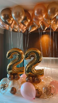 the number twenty two is surrounded by balloons