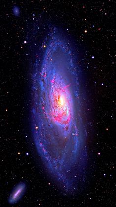 an image of a spiral galaxy in the dark night sky with stars and bright colors