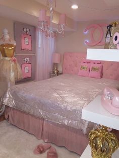 a bed room with a neatly made bed and chandelier