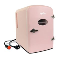 a pink refrigerator sitting on top of a white floor next to a plugged outlet