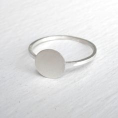 The Tiny Silver flat disk Ring is perfect for everyday wear. The design of this ring is very elegant and simple. The ring has a smooth, matte finish and the width of the band is 1 mm. The tiny flat disk has a diameter of 7mm. This ring is a perfect for stacking. Package in a brown kraft box. O U R ∙ P O L I C I E S http://etsy.me/3Q4WBQs M O R E ∙ F R O M ∙ U S https://virginiawynne.etsy.com www.virginiawynnedesigns.com https://www.facebook.com/VirginiaWynneDesigns Follow us on Instagram @virgin Simple Sterling Silver Round Signet Ring, Silver Minimalist Rounded Signet Ring, Silver Minimalist Signet Ring, Minimalist Everyday Signet Ring, Minimalist Rounded Signet Ring For Everyday, Silver Minimalist Stackable Rings, Simple Sterling Silver Signet Ring, Minimalist Sterling Silver Round Midi Rings, Minimalist Sterling Silver Midi Rings