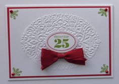 a white card with a red bow on it's side and the number twenty five