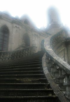 an old building with stone steps leading up to it