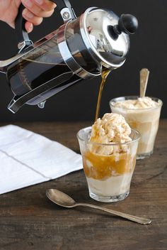 someone is pouring ice cream into a glass