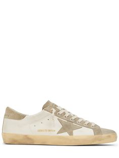 Leather upper. Front lace-up closure. Logo details. Rubber sole . Vintage effect may vary Vintage Effect, Golden Goose Sneakers, Golden Goose Deluxe Brand, Super Star, Crossbody Messenger Bag, Blue Sneakers, Low Top Sneakers, Sports Brands, Sneaker Brands