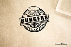 a burger logo is shown on a piece of paper