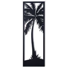 a black and white wall hanging with a palm tree in the center, on a white background