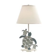 a lamp that has a turtle on it