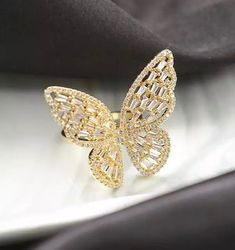 1 piece Weight: 15g Size: 3 x 3.7cm Surface Width: 3.5mm Stone Material: Zircon Size: adjustable Setting Type: Pave Setting Material: Copper (18k gold plated) Color: Gold, Silver, & Rose Gold Gold Butterfly Jewelry For Wedding, Adjustable Butterfly Shaped Yellow Gold Jewelry, Elegant Gold Butterfly Ring For Gift, Gold Butterfly Ring For Wedding, Adjustable Gold Butterfly Jewelry, Adjustable Butterfly Gold Jewelry, Gold Cubic Zirconia Butterfly Ring, Yellow Gold Butterfly Jewelry For Party, Adjustable Gold Butterfly Open Ring