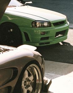 two cars parked next to each other on the street