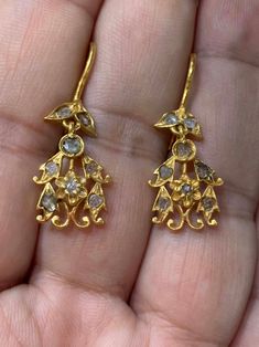 Antique Polki Diamond Chandelier Earrings -Total weight : 3.1 g. -Material : gold -Polki Diamond This Earrings is antique crafted by hand over 60 years. Please contact us if you have any questions. ABOUT PERANAKAN JEWELRY Peranakan jewelry is rare and skilfully crafted traditional gold providing a pedestal for Diamond and other precious stones to be mounted on. Each crafted piece holds the mystery of the individual who owns it and embraces an era in Baba history. Peranakan jewelry is fashioned w Traditional 22k Gold Earrings With 17 Jewels, Antique Yellow Gold Ceremonial Earrings, Gold Diamond Chandelier Earrings, Elegant Yellow Gold Chandelier Earrings With 17 Jewels, Antique Ceremonial Dangle Earrings, Antique Dangle Earrings For Ceremonies, Victorian Hallmarked Earrings For Ceremonial Occasions, Diamond Chandelier Earrings In Yellow Gold For Wedding, Antique Earrings With 17 Jewels For Ceremonial Occasions