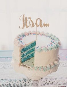 a white cake with blue frosting and a piece missing from it that says usa