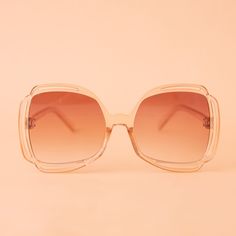 Add a touch of grooviness to your look with our Sofia Sunglasses in Champagne! These cute sunnies sport a playful clear and tan frame with a peachy gradient lens, making them a playful and eye-catching addition to any outfit. Trendy Clear Sunglasses For Spring, Trendy Clear Sunglasses For The Beach, Chic Clear Sunglasses For Summer, Trendy Clear Sunglasses For Beach, Clear Polarized Sunglasses For Spring, Trendy Clear Sunglasses With Tinted Lenses, Spring Clear Polarized Sunglasses, Trendy Clear Sunglasses With Gradient Lenses, Spring Clear Sunglasses With Uva Protection