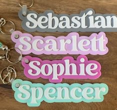 "The sweetest keychain!  Perfect for finding your book bag or sports bag quickly! This 6-8\" long name personalized name features two layers (name + background layer) of 1/8\" acrylic in colors shown. Classic Boho font will add a sweet touch to a school backpack or bag.  The length of the tag will depend on the letters in the name. Approx 1.5-2\" tall. Included with tassel and keychain hook. Colors of tassel will be random and coordinated, though not be the same color as acrylic. If you have a special request for tassel color please add a note when you order :) Font shown is the font used for this listing." Rectangular White Keychain For School, Personalized White Keychain For School, Customized Rectangular Keychains For School, Custom Name Pink Keychains For School, Custom Name White Keychains For Everyday Use, Custom Name White Keychain, Customized Multicolor Keychains For School, Customizable Cute School Keychains, Cute Customizable School Keychains