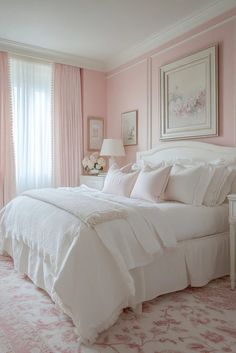 a bedroom with pink walls and white bedding