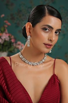 An elegant and classic Polki necklace set is the design that offers delicate hints of traditional legacies and Victorian art form of zirconia setting to bejewel your neckline. Embedded with high-grade Polkis this beauty is designed and handcrafted by artisans of India with traditional jewelry-making techniques. Embellish your appearance with our Polki-inspired necklace that has a resemblance to Bollywood jewelry. Add this charm of Indian Jewelry to your wardrobe and see the heads turn. A perfect Elegant Festive Jewelry Sets With Sparkling Stones, Festive Formal Crystal Jewelry Sets, Elegant Festive Jewelry Sets With Matching Earrings, Elegant Festive Jewelry Sets With Diamond Accents, Elegant Festive Jewelry Sets For Reception, Elegant Festive Crystal Jewelry Sets, Festive Elegant Crystal Jewelry Sets, Elegant Festive Kundan Necklace, Hand Set, Kundan Jewelry Sets With Elegant Design