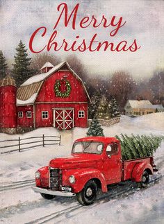 an old red truck with a christmas tree on the back is parked in front of a barn