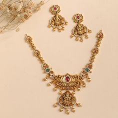 Product Description The Mrinali necklace set is designed in a vintage theme on a shining antique gold base to enhance your poise. The gleaming CZ stones add a highlight to this set making this best to choose for weddings and festivals. Style this set with a saree or layer with other antique necklace sets. Details & Specifications: Materials used: Antique Gold Plated Brass Weight -Necklace: 38 gms, Earrings: 17 gms, Length - Necklace: 13.5 cms, Earrings: 4.5 cms, Make it custom Want to make it a Gold Necklace Set With Jumka, Army Wallpapers, Antique Necklace Set, Indian Wedding Jewelry Sets, New Gold Jewellery Designs, Pearl Jewelry Design, Gold Chain Design, Solid Gold Necklace, Length Necklace