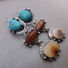 Manassas Turquoise, Sunstone and Dendritic Agate set in sterling silver.  These earrings measure slightly over 2 3/4 inches long and 3/4 inches wide at the widest point.  All components are sterling silver and have been oxidized and polished.  Each earring weighs:  10.4 grams Thanks for shopping!! Southwestern Style Jewelry With Oval Natural Stones, Southwestern Oval Natural Stones Jewelry, Southwestern Style Oval Natural Stone Jewelry, Silver Chrysocolla Cabochon Jewelry, Turquoise Agate Teardrop Jewelry, Turquoise Teardrop Agate Jewelry, Bohemian Style Cabochon Dangle Jewelry, Southwestern Sterling Silver Gemstone Jewelry, Nickel-free Oval Agate Jewelry