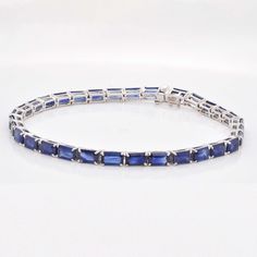 Indulge in the timeless allure of our 18K White Gold Octagon Blue Sapphire Tennis Bracelet—an exquisite blend of sophistication and elegance. Crafted with meticulous precision, this bracelet features a stunning array of octagon-cut blue sapphires, each gemstone meticulously set in lustrous white gold Timeless Blue Bracelet For Formal Occasions, Classic Emerald Cut Gemstone Bracelets, Timeless Blue Diamond Bracelet, Luxury Blue Diamond Bracelet, Classic Sapphire Gemstone Tennis Bracelet, Luxury Sapphire Gemstone Tennis Bracelet, Elegant Octagon Diamond Bracelet For Formal Occasions, Luxury Sapphire Tennis Bracelet For Formal Occasions, Classic Sapphire Bracelets For Formal Occasions