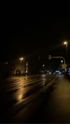 an empty street at night in the rain