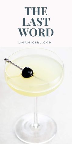 the last word cocktail in a martini glass with an olive garnish on top