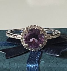 "This lovely halo ring features one round amethyst surrounded by tiny round diamonds that extend to about 1/4\" along the band on either side. The delicate purple shine of the amethyst and the twinkle of the diamonds make this ring simply dreamy! It is marked 14K, is a size 6 1/2 and is in beautiful condition. Please see all photos for details. Thank you for looking!" Chrysoprase Ring, Amethyst And Diamond Ring, Amethyst Gem, Gold Halo, Purple Band, Ring Photos, Halo Ring, Halo Rings, Art Deco Fashion