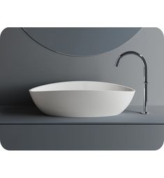 a white bowl sink sitting on top of a counter next to a faucet