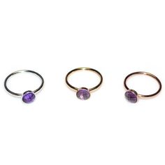 Simple and delicate yet ultra stylish 14k rose gold filled amethyst nose ring. This can be a perfect gift for you or your beloved ones! It can be used for earlobe, cartilage, helix and tragus piercing as well. * The listing is for 1 (one) hoop. * Wire ends were rounded and polished to provide you with a smooth end for insertion. The earring was then polished. * Available inner diameters in millimeters (widths) for your ring: 7mm, 8mm, 9mm, 10mm * You can choose among variety of gemstones for thi Small Hoop Stackable Piercings For Gift, Stackable Hoop Septum Ring As Gift, Stackable Small Hoop Piercings As Gift, Dainty Internally Threaded Hoop Rings, Dainty Hoop Rings With Internally Threaded Details, Stackable Round Nose Rings For Gifts, Stackable Round Nose Rings As Gift, Gift Stackable Round Nose Rings, Stackable Round Cartilage Earrings For Gifts