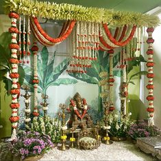 a mandap decorated with flowers and garlands