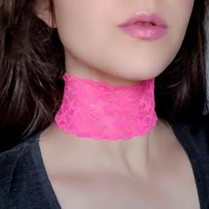 "A super wide star-patterned hot pink choker that's practically glowing! Features comfy stretch lace and adjustable bronze lobster claw clasp and chain closure. Due to the lighting, actual color is best represented in flat lay photos. The length shown in the photos is 11.5\" on a model with a 12\" neck. Each size comes with an additional 2.5\" extender chain. When selecting your stretch choker necklace length, measure around the smallest part of your neck and subtract .5\". If you're in between Adjustable Rave Choker For Gift, Adjustable Rave Choker As Gift, Adjustable Rave Choker For Gifts, Adjustable Pink Choker For Festivals, Adjustable Rave Choker For Festival, Adjustable Pink Choker For Party, Pink Adjustable Choker For Party, Adjustable Rave Style Choker, Adjustable Pink Trendy Choker